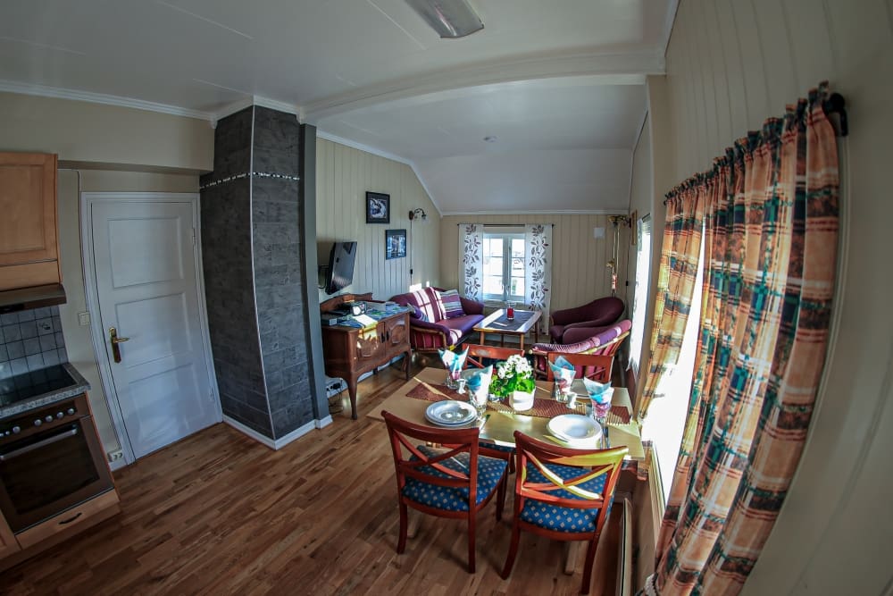 Dining table and living room in Messa 2 floor, Holiday house in Lyngen